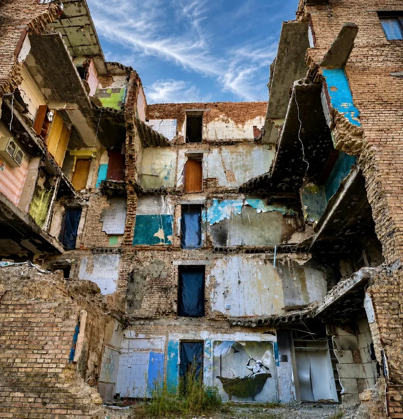 Banksy mural on a bombed building in Ukraine